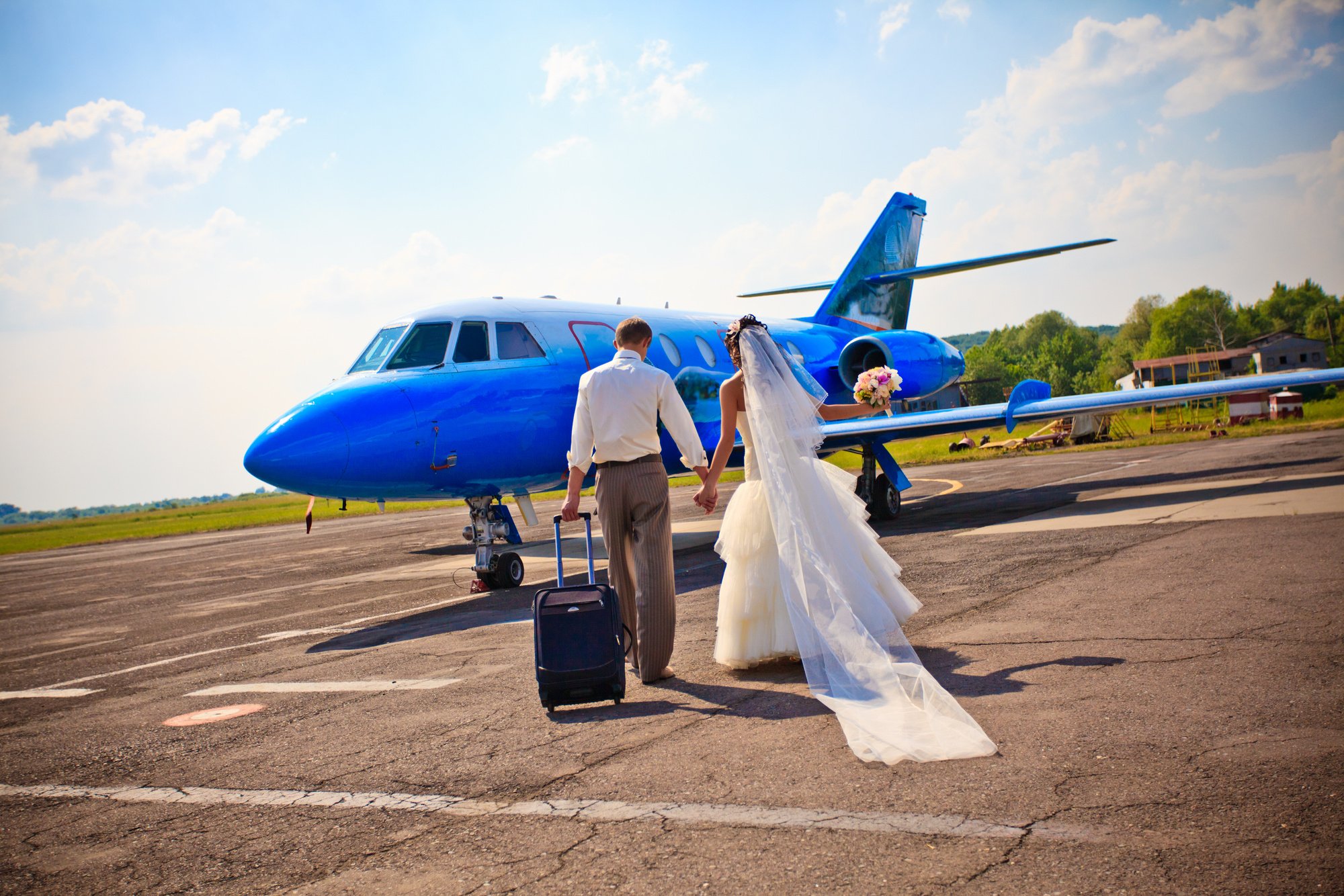 Wedding Couple Fly on Honeymoon